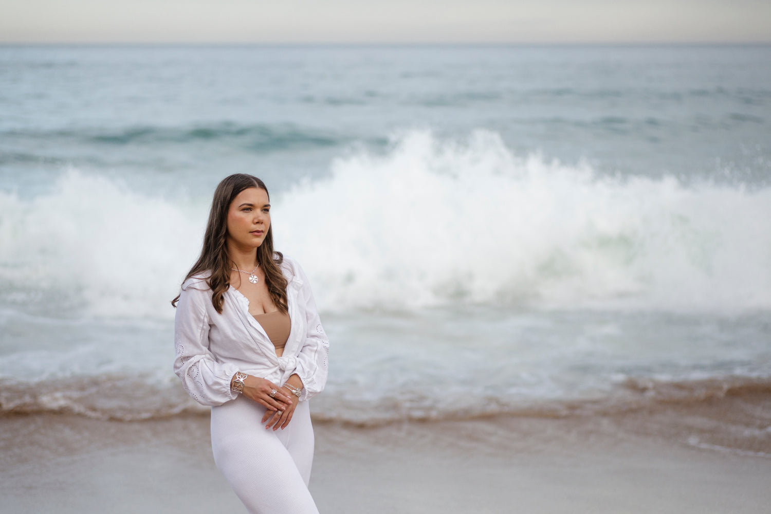 Kati-Rose against seascape, wearing Baltic Folk Jewelry